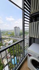 Modern balcony with urban view and laundry facilities