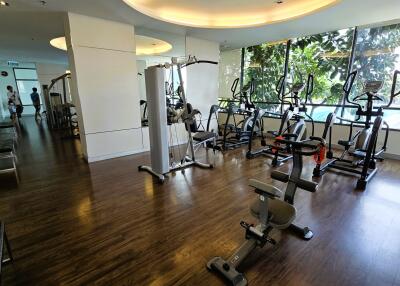 Modern gym in residential building with variety of equipment