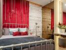 Elegant bedroom with red accent wall and modern decor