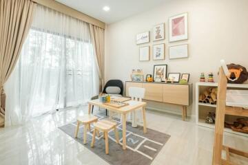 Bright and well-decorated living room with children