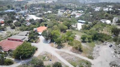 Aerial view of a residential area with diverse housing and greenery