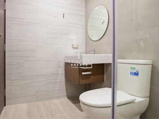 Modern bathroom with elegant fixtures and neutral tile design