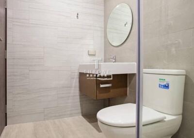 Modern bathroom with elegant fixtures and neutral tile design