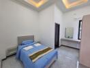 Spacious bedroom with modern lighting and stylish furnishings