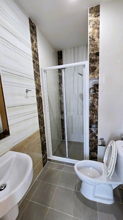 Modern bathroom with walk-in shower and elegant tiling