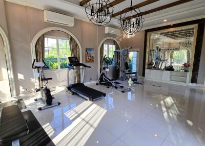 Spacious home gym with modern equipment and large windows