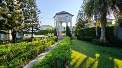 Elegant garden with gazebo and landscaped pathway