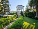 Elegant garden with gazebo and landscaped pathway