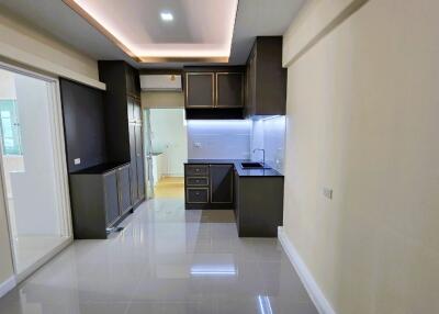 Modern compact kitchen with integrated appliances