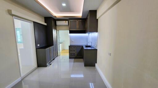 Modern compact kitchen with integrated appliances