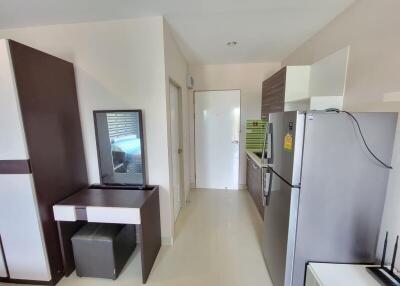 Modern kitchen interior with white tiles and fitted appliances