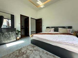 Elegant bedroom with modern design and plush furnishings