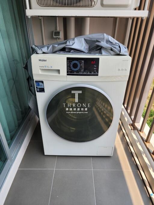 Washing machine on a modern apartment balcony