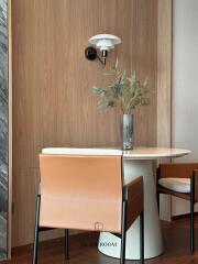 Stylish dining area with modern wooden wall and elegant furnishings