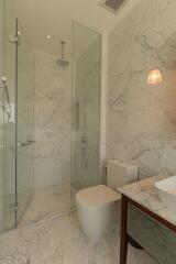 Elegant bathroom with marble walls and modern fixtures