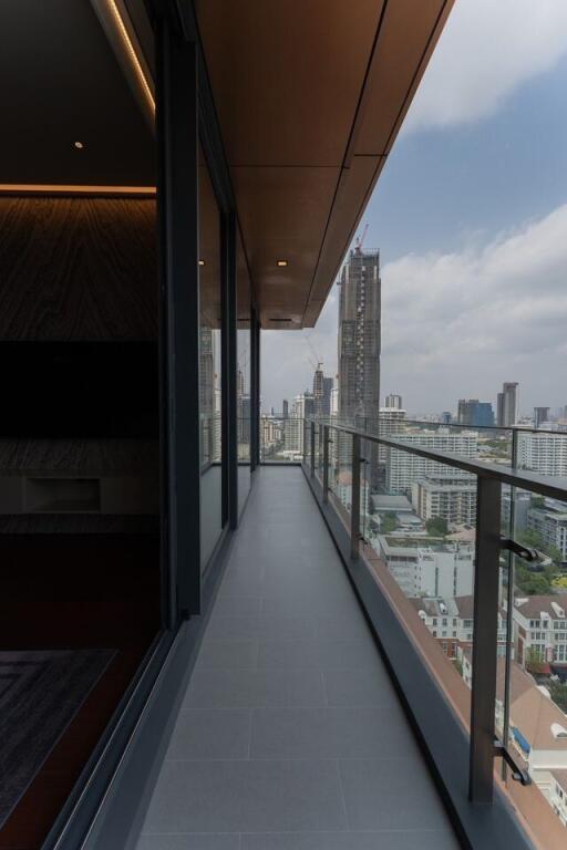 Spacious balcony with city view and protective railing