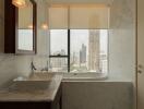Luxurious marble bathroom with city view