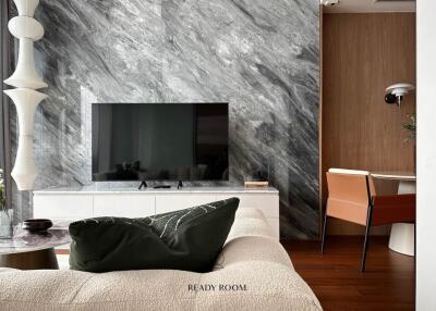Elegant living room with marble wall and modern furniture