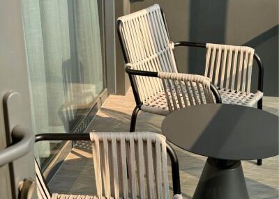 Stylish balcony with modern furniture and natural lighting