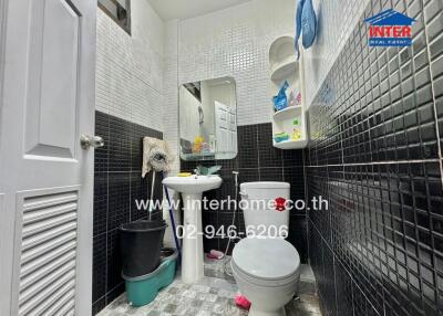 Compact bathroom interior with toilet and sink