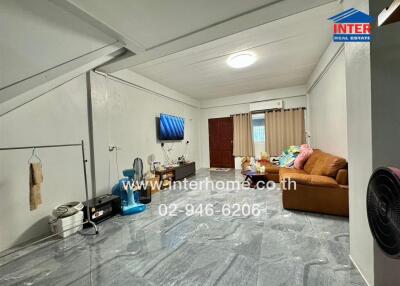 Spacious and well-lit living room with modern amenities