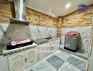 Modern kitchen with marble walls and well-equipped cooking area