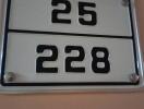 Apartment number plaque showing 25-228