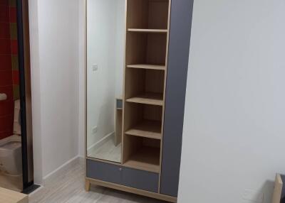 Spacious bedroom with built-in wardrobe and wooden flooring