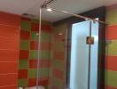 Modern bathroom with colorful tile walls