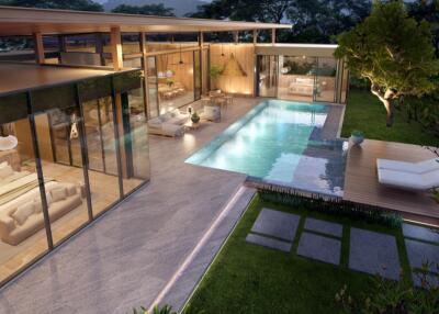 Luxurious backyard with swimming pool and glass-walled living spaces at dusk