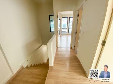 Bright and modern hallway with wooden flooring