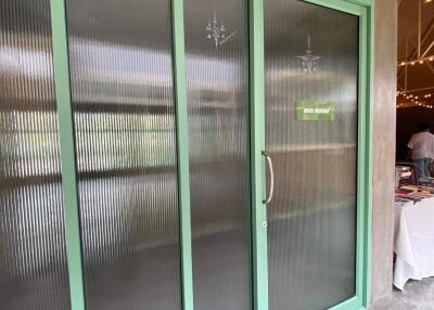 Frosted glass sliding doors with turquoise frames