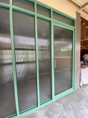 Frosted glass sliding doors with turquoise frames