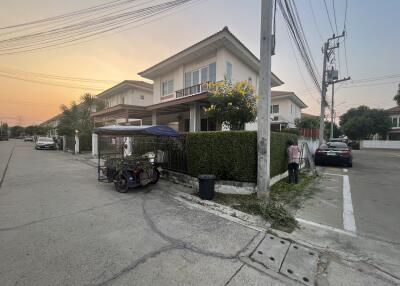 Suburban two-story house at sunset