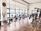 Spacious residential gym with modern equipment and large windows