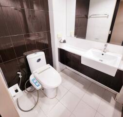 Modern bathroom with electronic toilet and sleek vanity