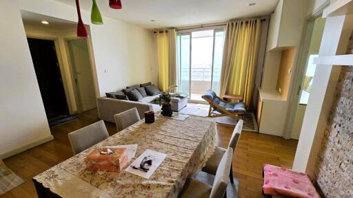 Spacious living room with dining area and balcony access