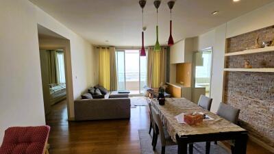 Spacious and well-lit living room with combined dining area