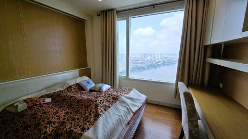 Cozy bedroom with city view and ample natural light