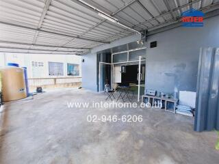 Spacious garage with ample storage and workspace area