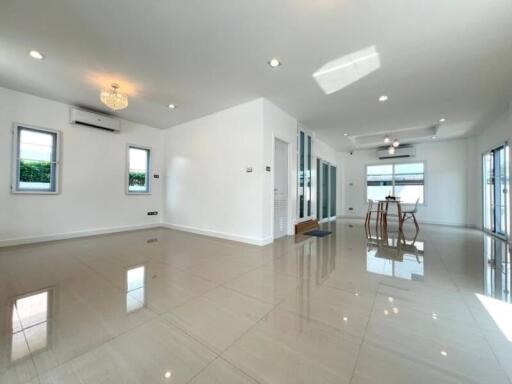 Spacious and modern living room with high ceilings and natural light