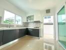 Modern kitchen with sleek cabinetry and ample natural light