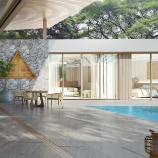 Modern outdoor patio with pool and dining area in a luxury house