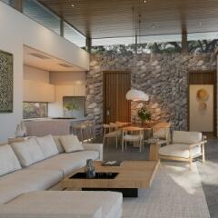 Modern spacious living room with combined dining area and adjacent kitchen