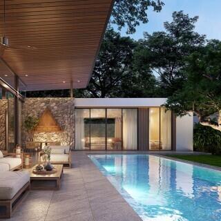 Elegant outdoor living area with swimming pool and modern home exterior at dusk