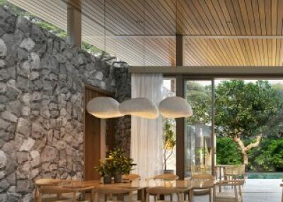 Modern dining area with natural stone and wood accents