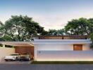 Modern single-story residential home with garage during twilight
