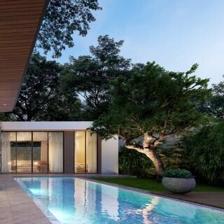 Luxurious outdoor pool by modern home with lush landscaping