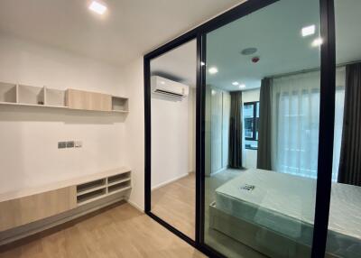 Modern bedroom with large mirror wardrobe
