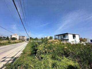 Modern house along the roadside with clear blue sky